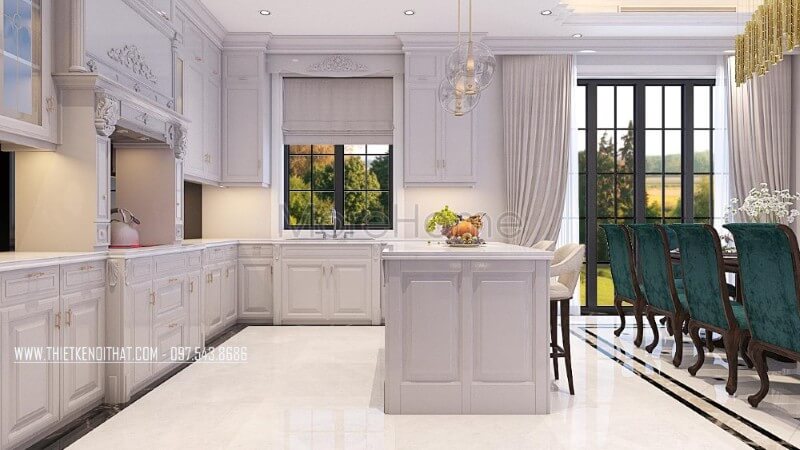 Không gian phòng bếp biệt thự được sử dụng khá nhiều các cột tròn với chi tiết trạm khắc nhẹ nhàng là một trong những đặc điểm điển hình của phong cách thiết kế nội thất tân cổ điển Thiết kế nội thất phòng bếp biệt thự tân cổ điển