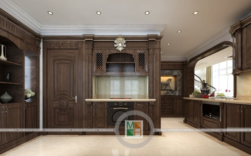 Thiết kế phòng bếp chung cư đẹp có hệ tủ bếp gỗ tự nhiên nâu trầm với kiểu dáng tinh tế, nghệ thuật mang đến vẻ đẹp sang trọng, đẳng cấp cho căn phòng. Thiết kế phòng bếp chung cư tân cổ điển đẹp